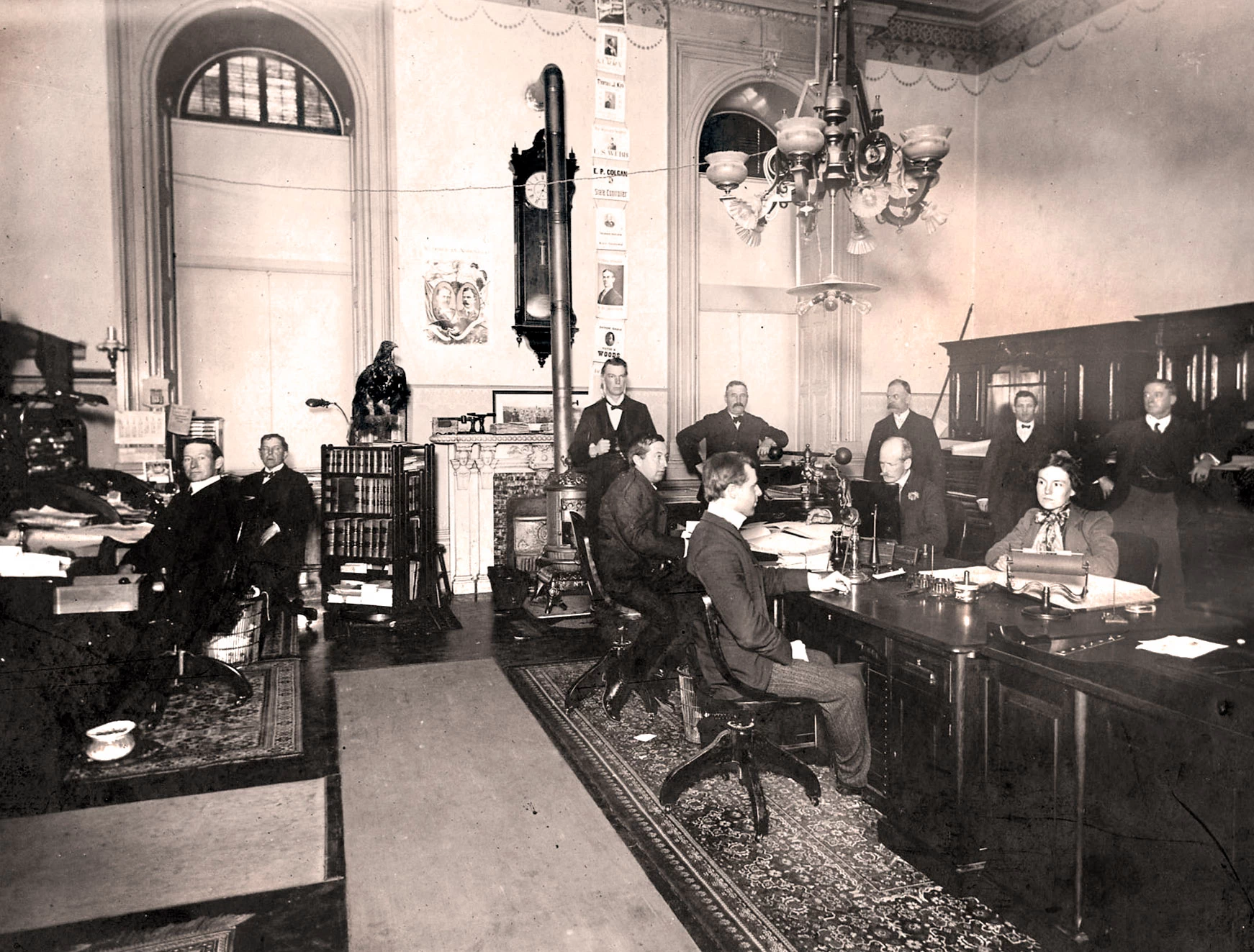 Historical image of men and women in the 1902 Secretary of State’s Office. Historical image of men and women in the 1902 Secretary of State’s Office.